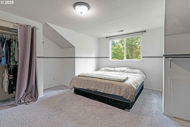 13465 SW Lancewood St, Beaverton, OR 97008 - carpeted bedroom with a textured ceiling, baseboards, and a closet