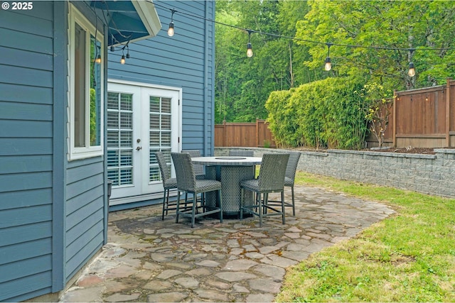13465 SW Lancewood St, Beaverton, OR 97008 - fenced backyard featuring french doors, a patio area, and outdoor dining space