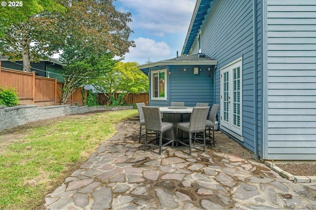 13465 SW Lancewood St, Beaverton, OR 97008 - fenced backyard with a patio area, french doors, and outdoor dining area