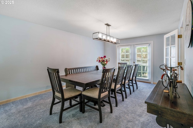 13465 SW Lancewood St, Beaverton, OR 97008 - dining room featuring carpet, a chandelier, and a textured ceiling