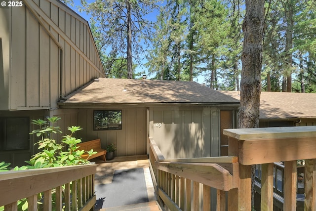 103 Treehill Loop, Eugene, OR 97405 - view of exterior entry featuring a shingled roof and board and batten siding