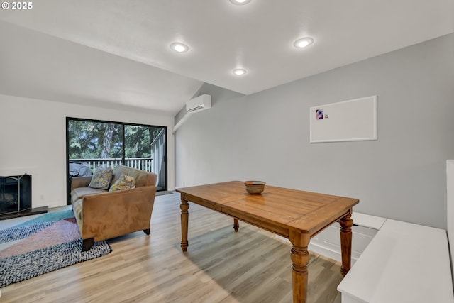 103 Treehill Loop, Eugene, OR 97405 - living room featuring an AC wall unit, light wood-style flooring, recessed lighting, and lofted ceiling