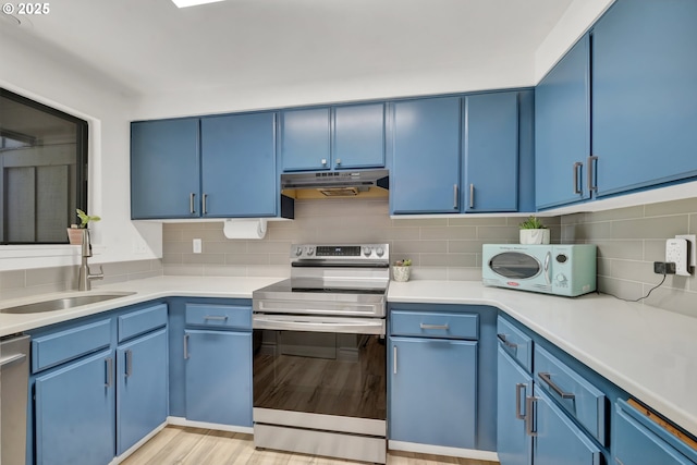 103 Treehill Loop, Eugene, OR 97405 - kitchen with appliances with stainless steel finishes and blue cabinets