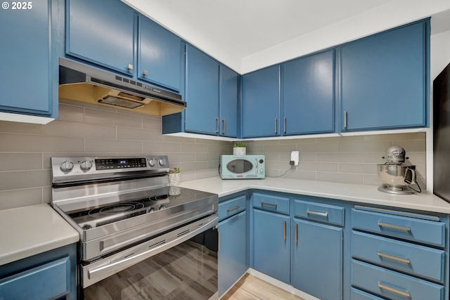 103 Treehill Loop, Eugene, OR 97405 - kitchen featuring stainless steel electric stove, blue cabinetry, and under cabinet range hood