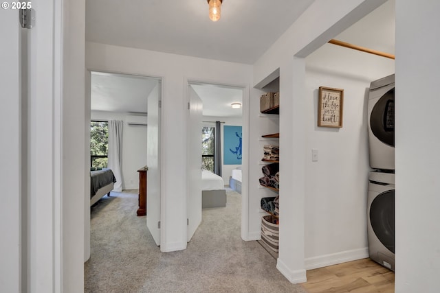 103 Treehill Loop, Eugene, OR 97405 - hall with an AC wall unit, stacked washer and clothes dryer, and carpet