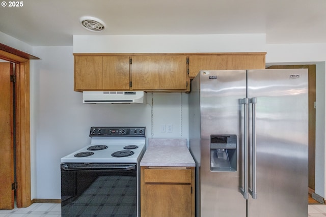 30563 Fairview Rd, Lebanon, OR 97355 - kitchen featuring high end refrigerator, range with electric stovetop, exhaust hood, light countertops, and light floors