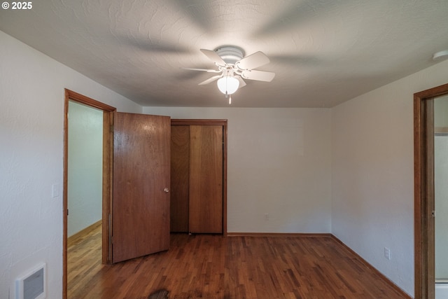 30563 Fairview Rd, Lebanon, OR 97355 - unfurnished bedroom featuring wood finished floors, baseboards, and a ceiling fan