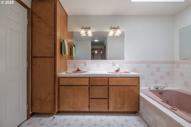 30563 Fairview Rd, Lebanon, OR 97355 - bathroom featuring a tub with jets, double vanity, and backsplash