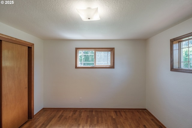 30563 Fairview Rd, Lebanon, OR 97355 - unfurnished bedroom with a closet, wood finished floors, and baseboards