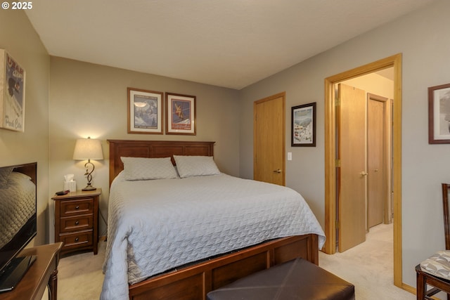 bedroom featuring light colored carpet