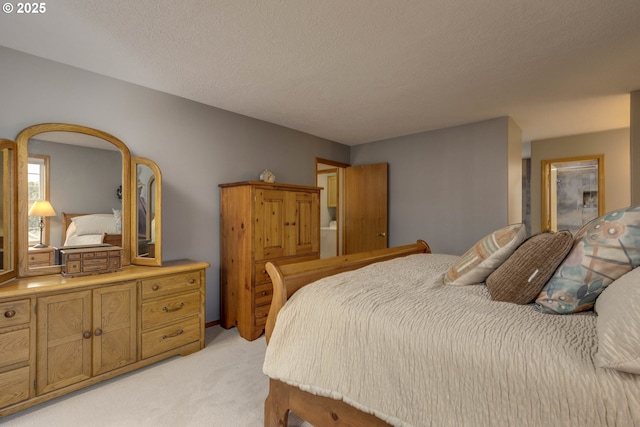 bedroom featuring light carpet and a textured ceiling