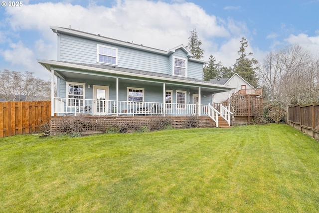 view of front of house with covered porch, a front lawn, and fence private yard