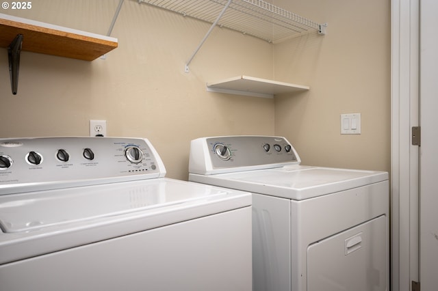 clothes washing area with laundry area and separate washer and dryer