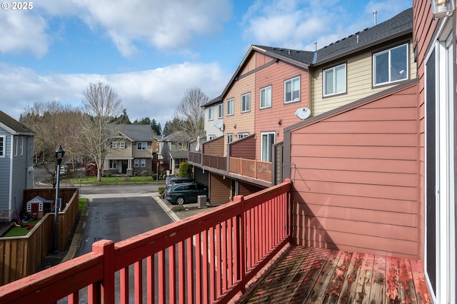 wooden terrace with a residential view