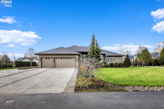 view of front of house featuring an attached garage, fence, concrete driveway, stone siding, and a front lawn