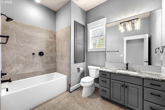 bathroom with toilet, shower / bathtub combination, baseboards, and vanity