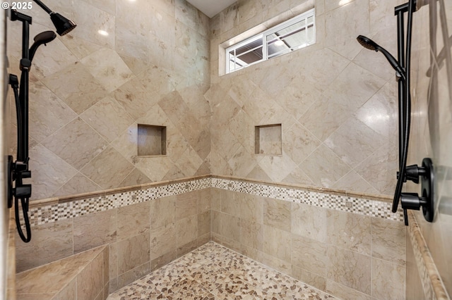 full bathroom featuring tiled shower