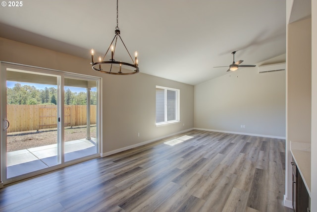 113 Citation Ct, Winston, OR 97496 - spare room featuring lofted ceiling, a chandelier, wood finished floors, a ceiling fan, and baseboards