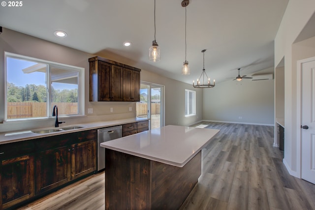 113 Citation Ct, Winston, OR 97496 - kitchen with dishwasher, a sink, ceiling fan, light countertops, and dark brown cabinets