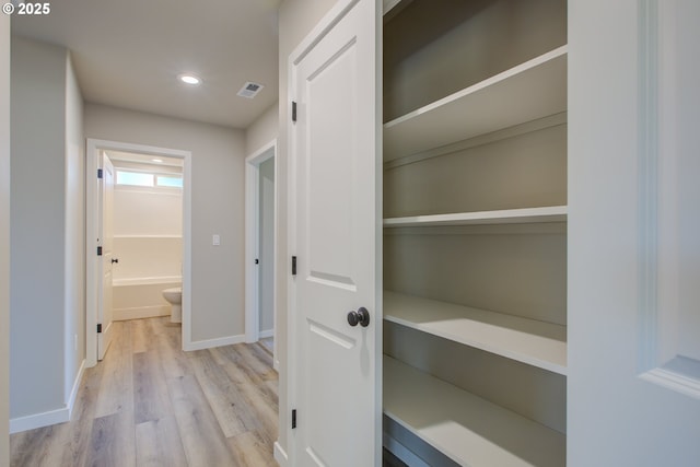 113 Citation Ct, Winston, OR 97496 - hallway featuring light wood-style flooring, baseboards, and recessed lighting