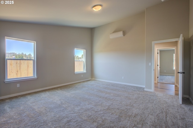 113 Citation Ct, Winston, OR 97496 - carpeted empty room with baseboards and an AC wall unit