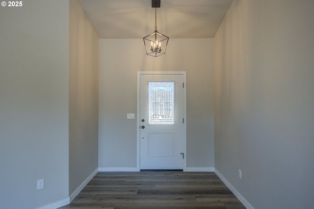 113 Citation Ct, Winston, OR 97496 - doorway with a chandelier, dark wood finished floors, and baseboards