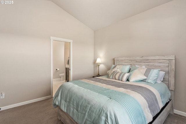bedroom featuring high vaulted ceiling, carpet flooring, baseboards, and connected bathroom