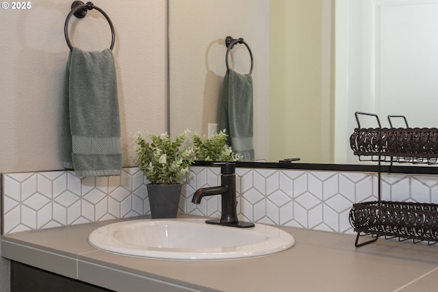 bathroom with vanity and decorative backsplash