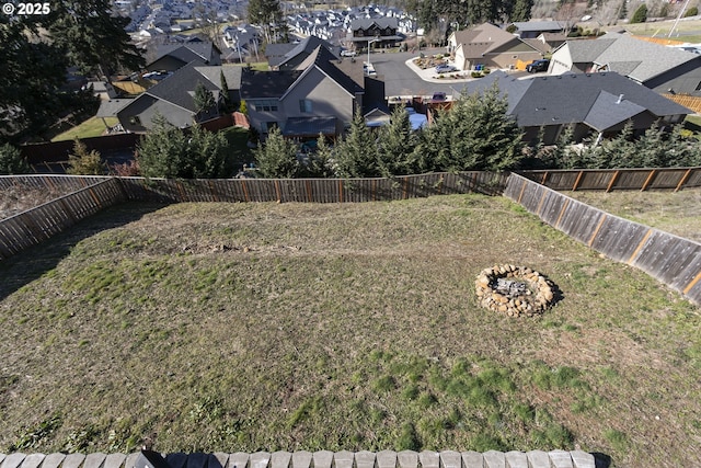 view of yard with a fenced backyard and a residential view