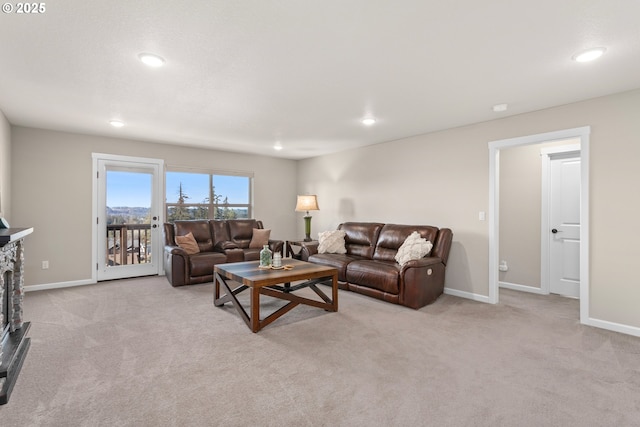 carpeted living room featuring baseboards and recessed lighting