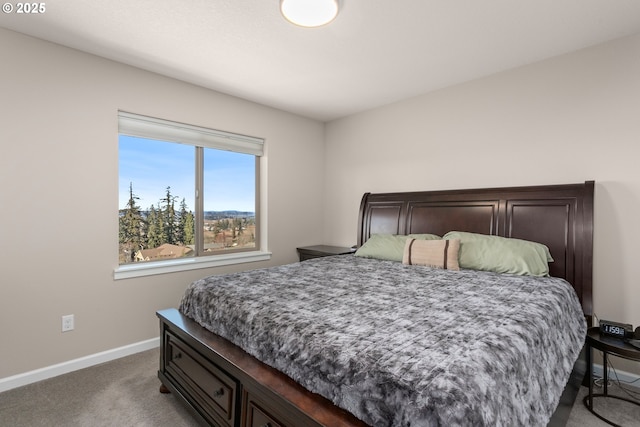 carpeted bedroom with baseboards