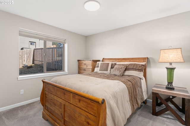 bedroom with baseboards and carpet flooring