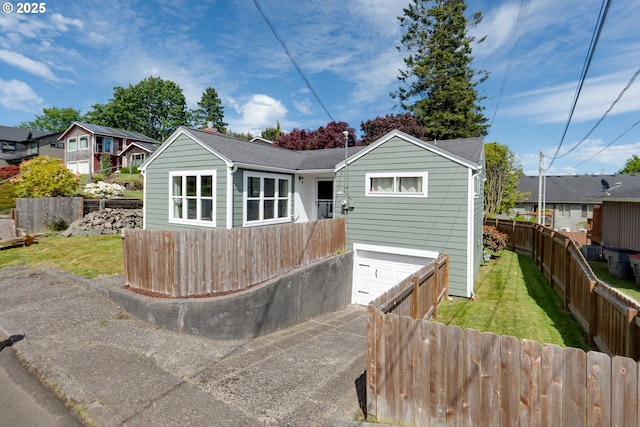 1858 5th St, Astoria, OR 97103 - rear view of house featuring driveway, an attached garage, and a residential view