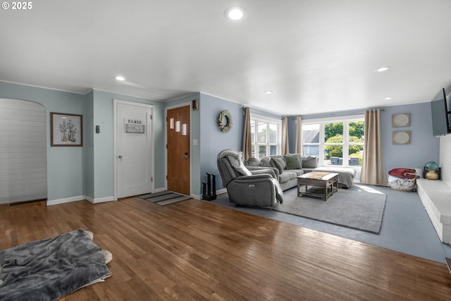 1858 5th St, Astoria, OR 97103 - living room with arched walkways, baseboards, recessed lighting, and wood finished floors