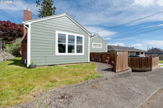 1858 5th St, Astoria, OR 97103 - rear view of property with a chimney