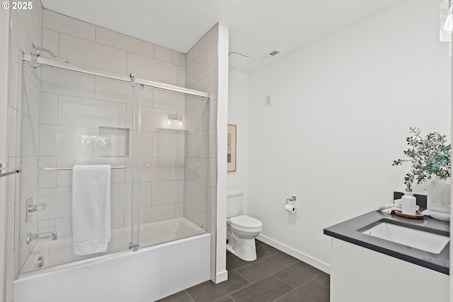full bathroom with toilet, shower / bath combination with glass door, baseboards, and vanity