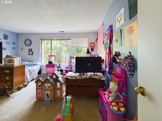 bedroom with carpet floors and a textured ceiling