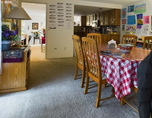 view of carpeted dining area