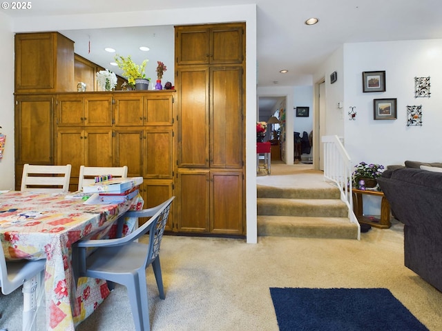 interior space featuring stairway, recessed lighting, and light colored carpet