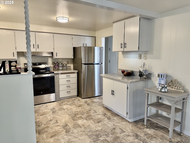 kitchen with stainless steel appliances, white cabinets, and light stone counters