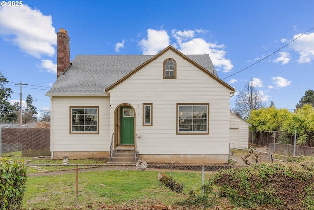 bungalow-style house featuring a front yard