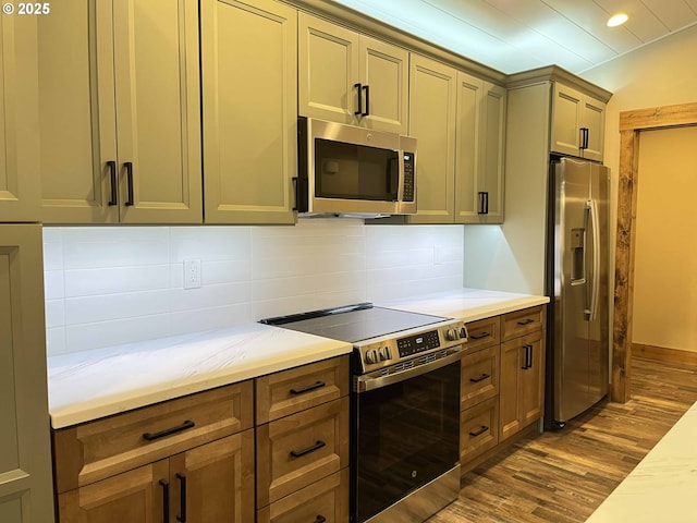 88366 4th Ave, Florence, OR 97439 - kitchen with recessed lighting, dark wood finished floors, tasteful backsplash, and stainless steel appliances