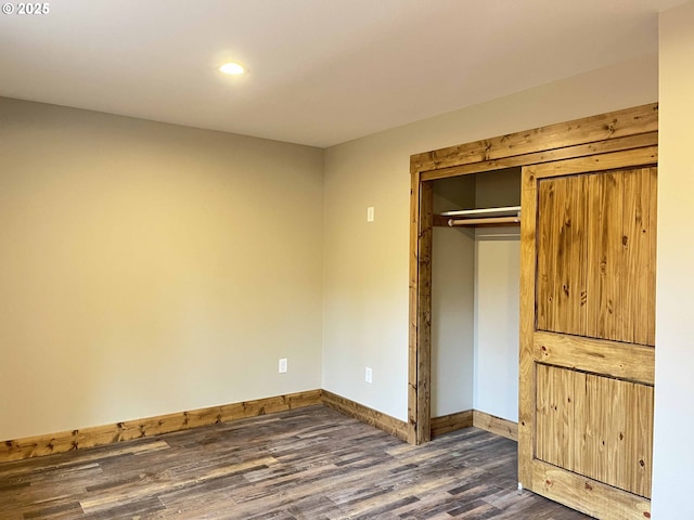 88366 4th Ave, Florence, OR 97439 - unfurnished bedroom with recessed lighting, baseboards, dark wood finished floors, and a closet