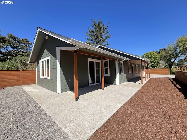 88366 4th Ave, Florence, OR 97439 - back of house featuring a patio area and fence