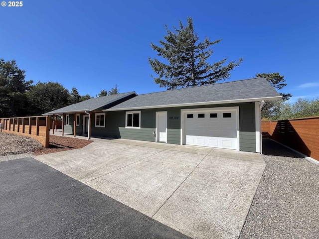 88366 4th Ave, Florence, OR 97439 - ranch-style home featuring concrete driveway, roof with shingles, fence, and a garage