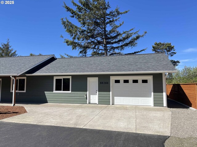 88366 4th Ave, Florence, OR 97439 - ranch-style house with a shingled roof, driveway, fence, and a garage