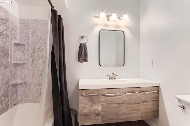 full bathroom featuring shower / bath combo with shower curtain, toilet, and vanity