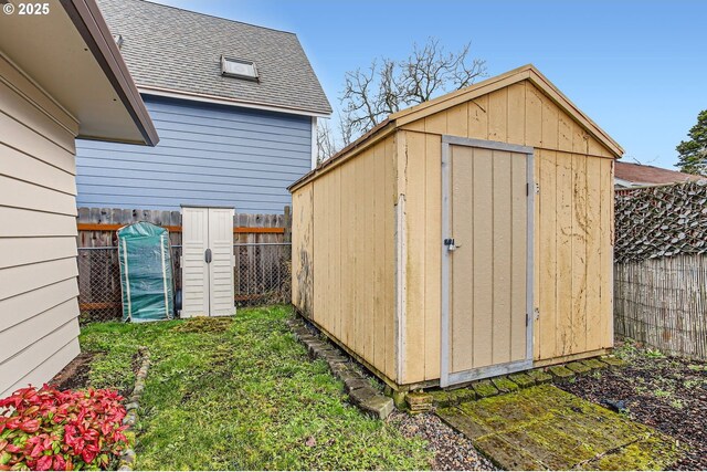 view of shed featuring a fenced backyard