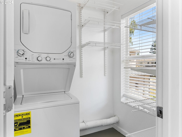 laundry area with stacked washer / dryer