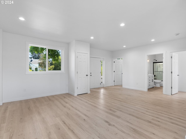 spare room with light wood-type flooring